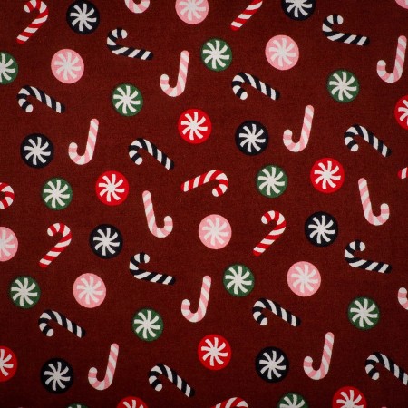 Popelín navideño rojo con bastones de caramelo y bolas navideñas