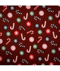 Popelín navideño rojo con bastones de caramelo y bolas navideñas