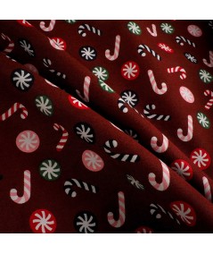 Popelín navideño rojo con bastones de caramelo y bolas navideñas